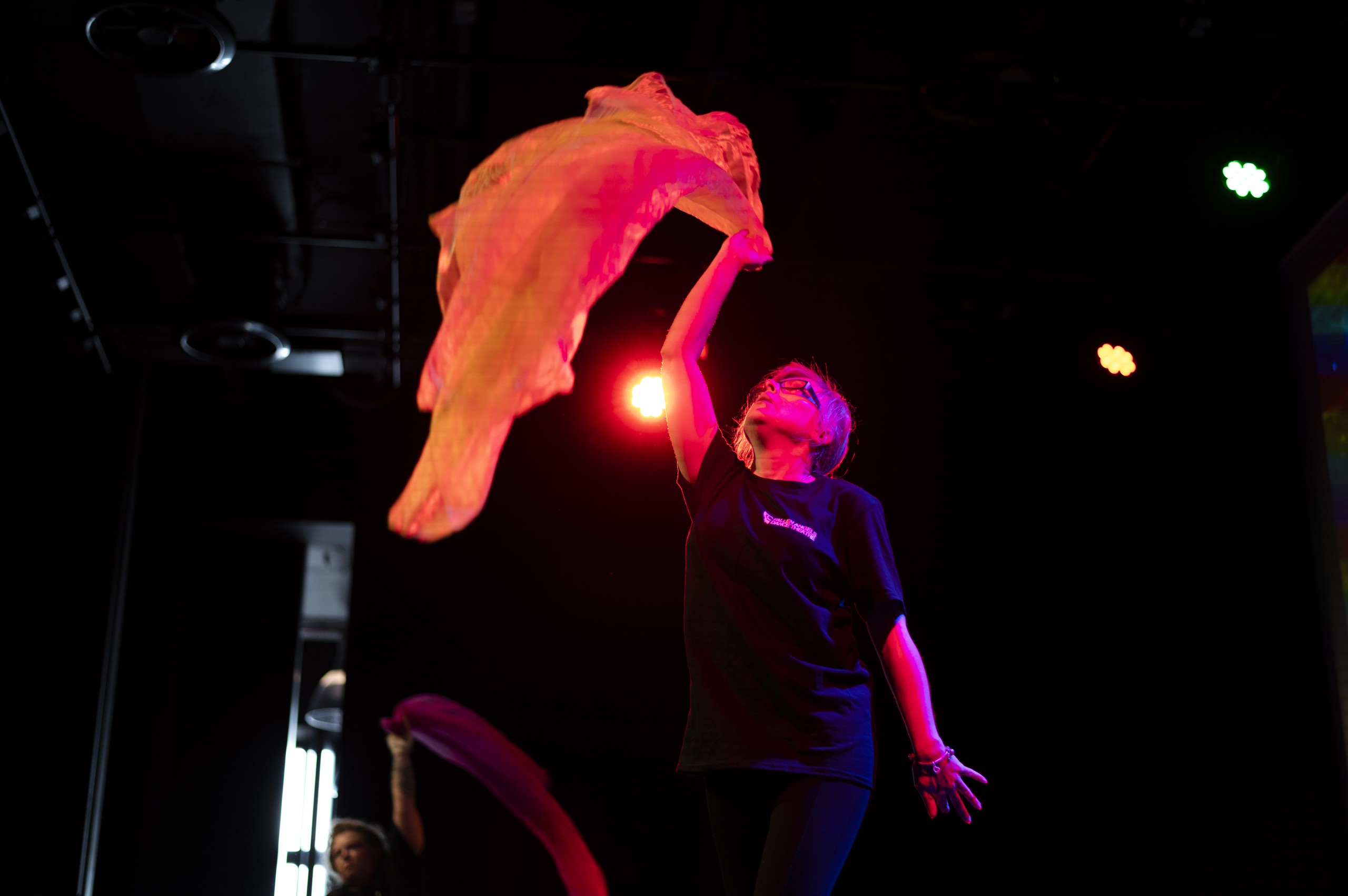 Empowering Women Through Dance, Fallen Angels Dance Theatre Chester, Dancer moving with billowing scarf, at Storyhouse, Chester