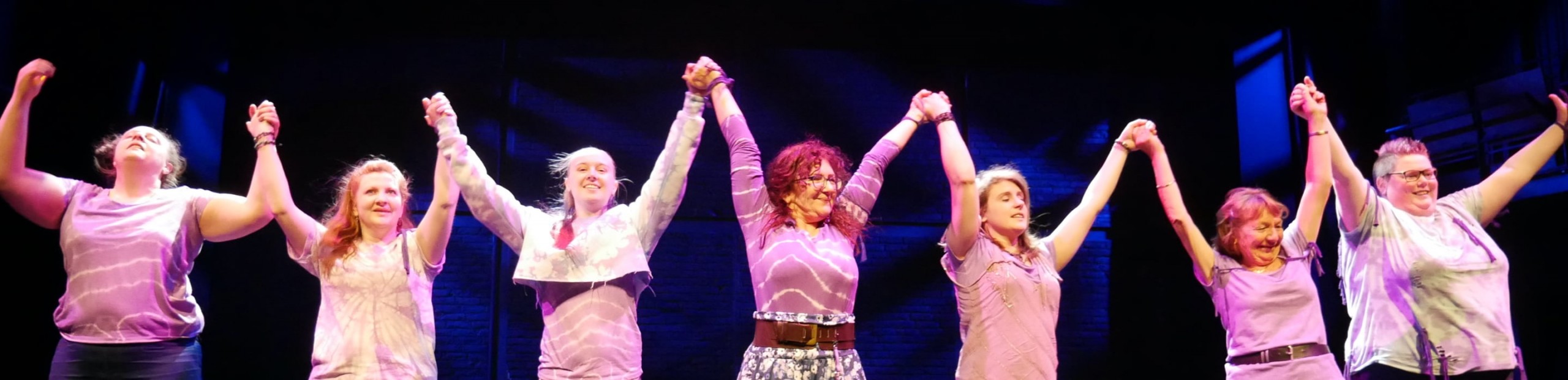 Dancers holding hands ready to bow