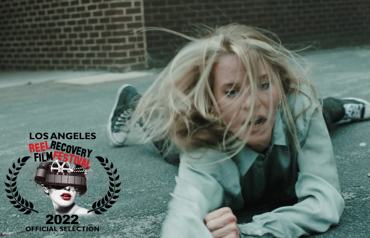 Film Still from I Fall with logo of Recovery Film Festival